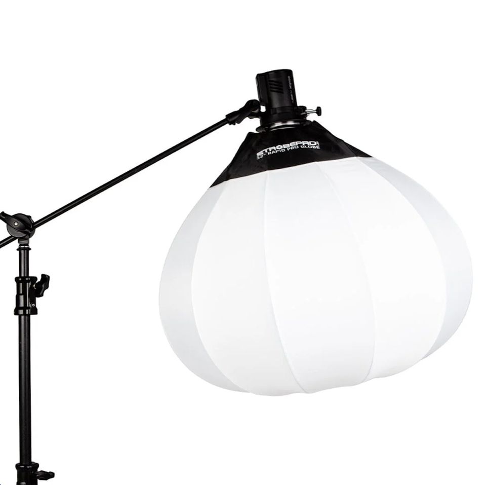 A lantern-style studio light on a boom stand